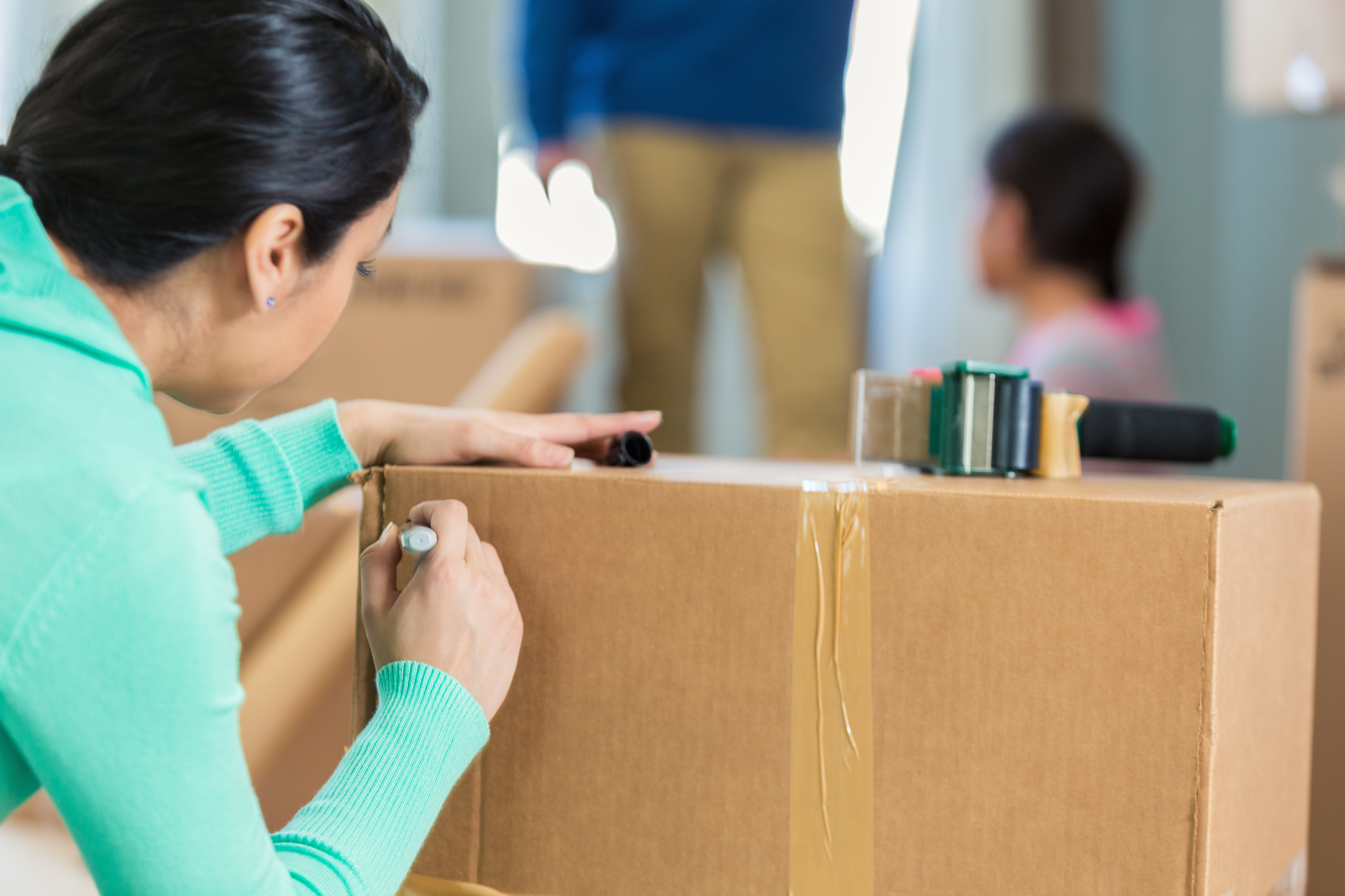 Woman Labeling Moving Box