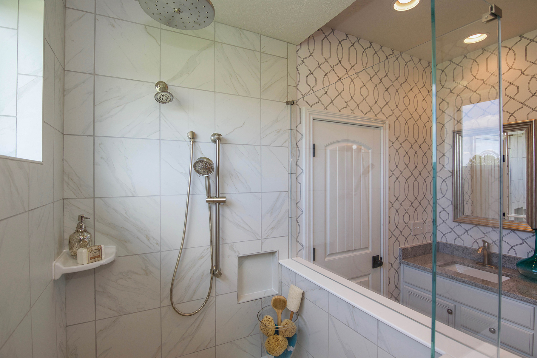 [Marble-Look Tiled Shower With Organizer on Floor]