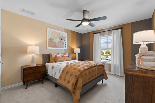 Image of a children's bedroom with safari-inspired decor and yellow wall colors