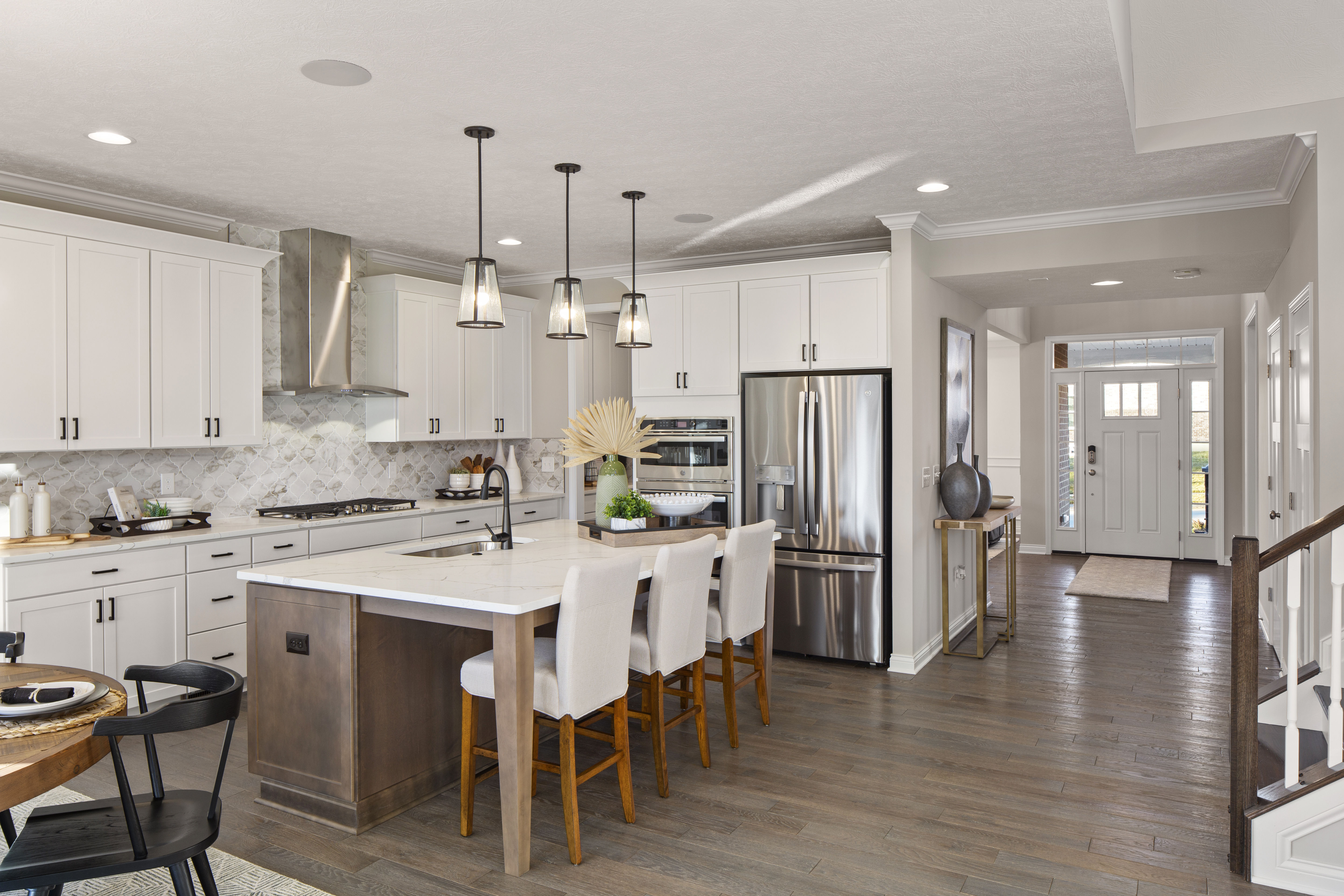 White Kitchen With Decorated Island