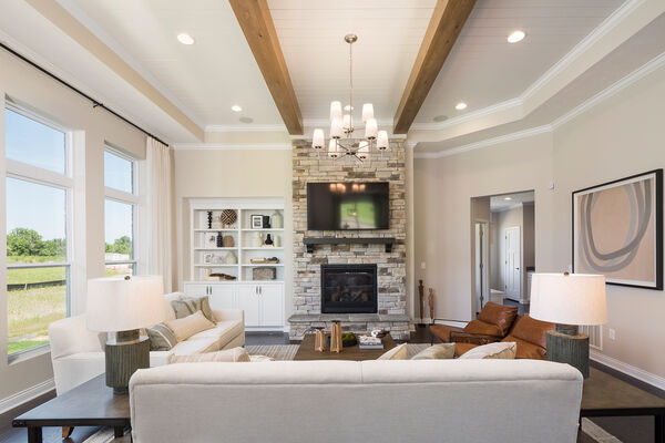 Paired Villa Family Room With Couches and Stone Fireplace