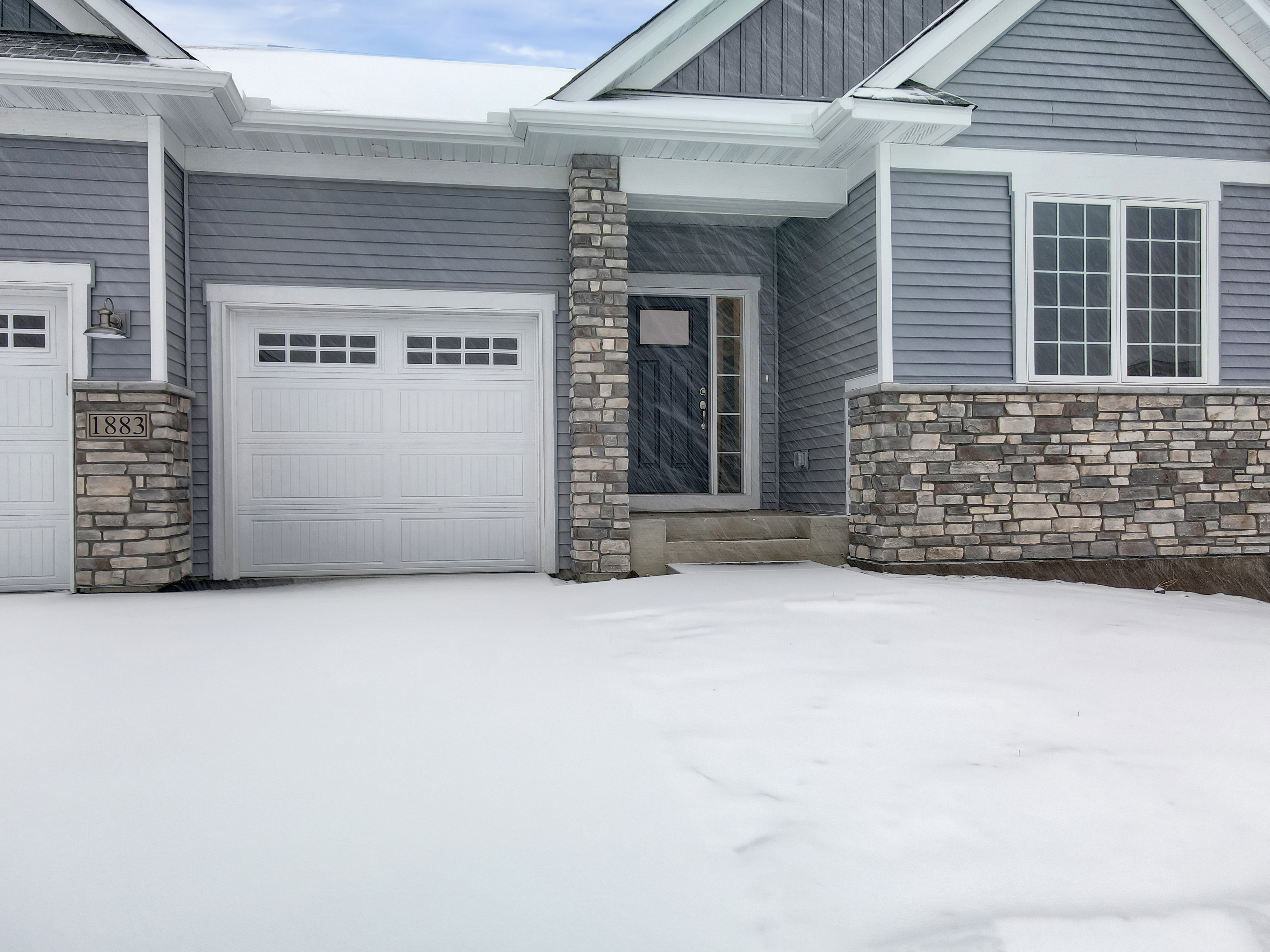 Townhome Exterior With Snow Outside