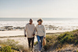 Couple Walking Back From Beach