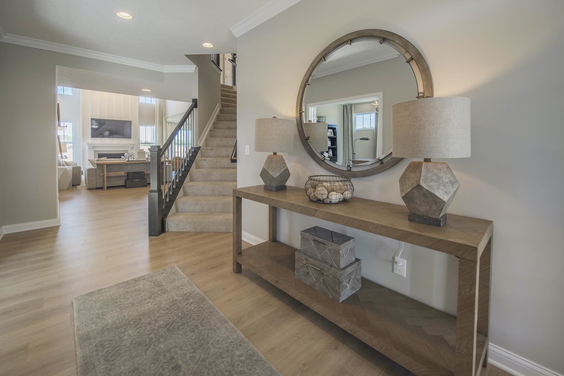 Open foyer with a console table and a mirror