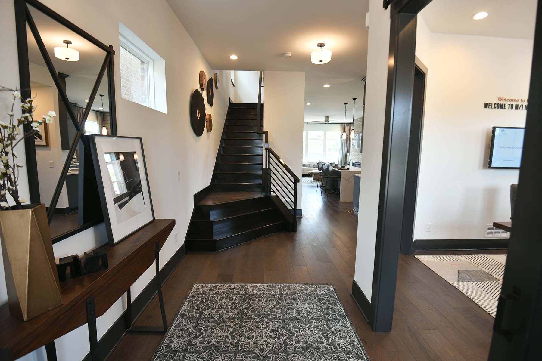 [Set of wood stairs leading up to the second floor of a modern home]