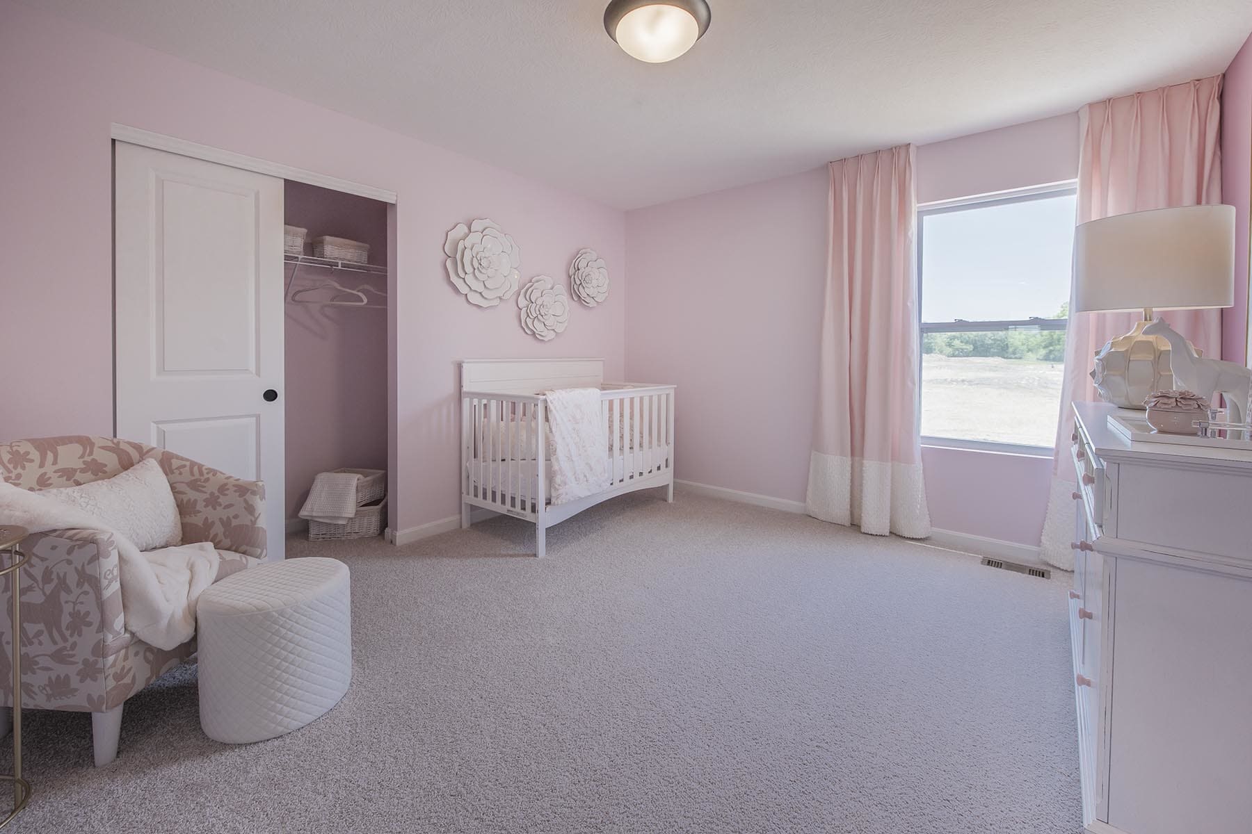 Nursery Room With Pink Pastel Finishes