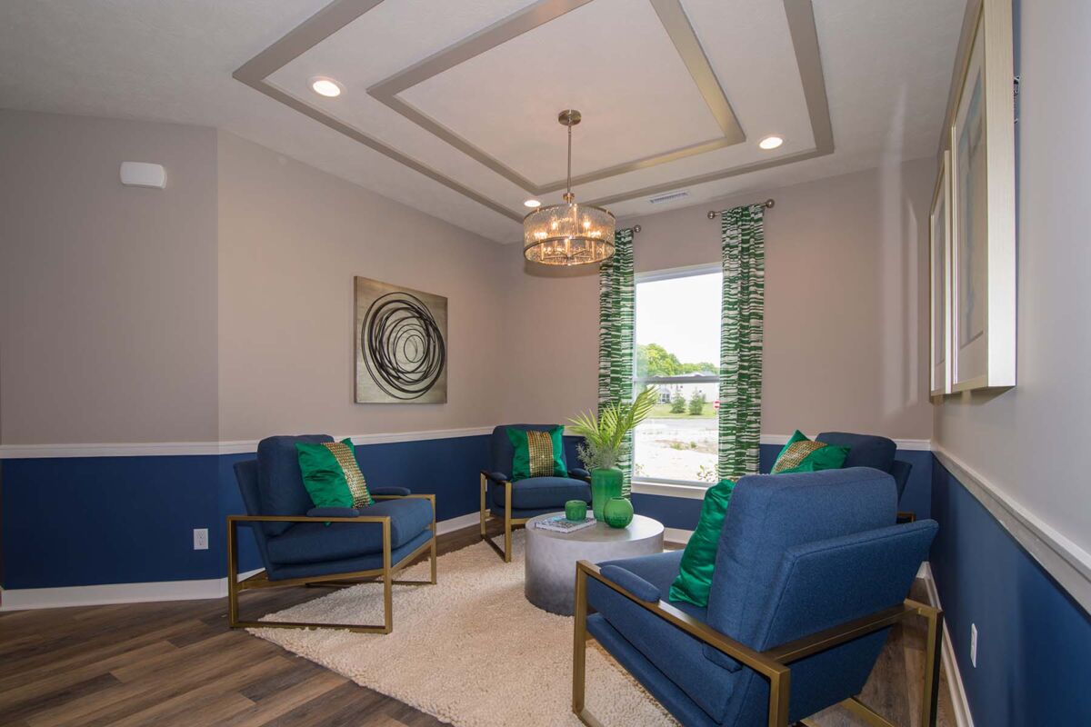 Green and Blue Sitting Room With Ombre Gray Coffee Table