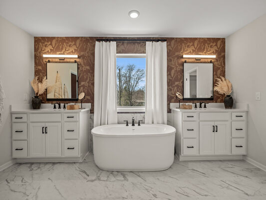 Image of a bathroom with terracotta, floral wallpaper