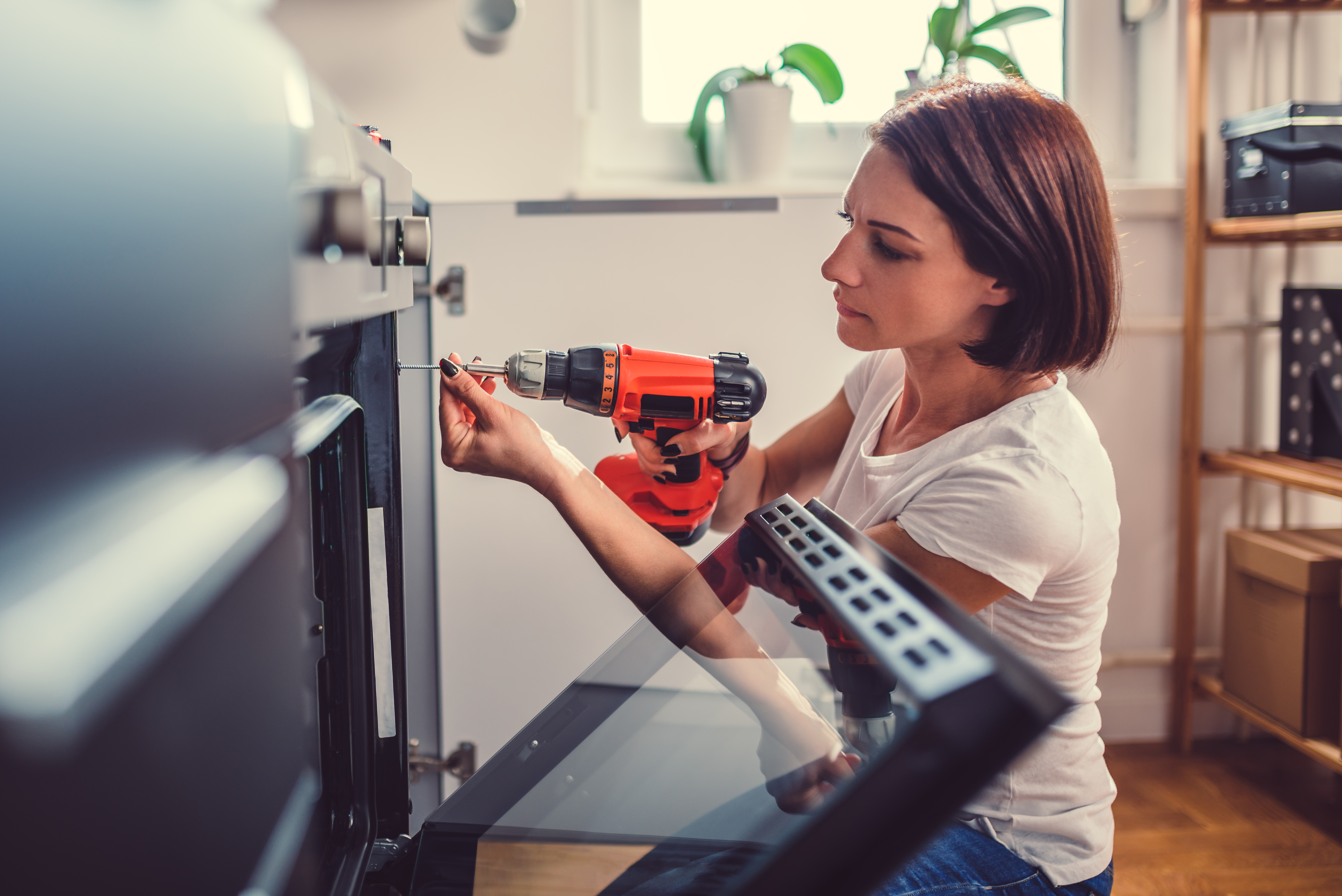 Woman Using Drill