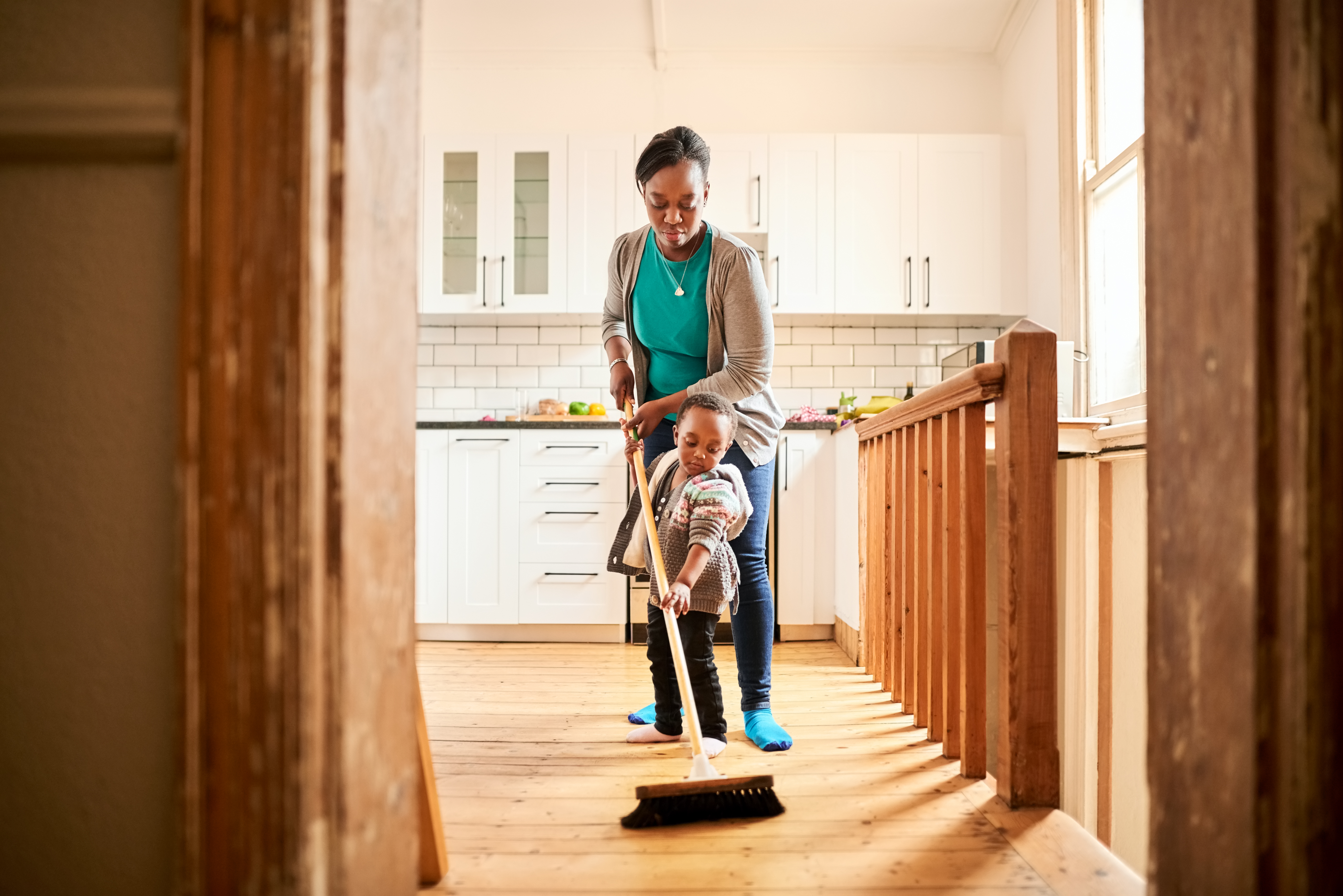 Mother Helping Child Sweep