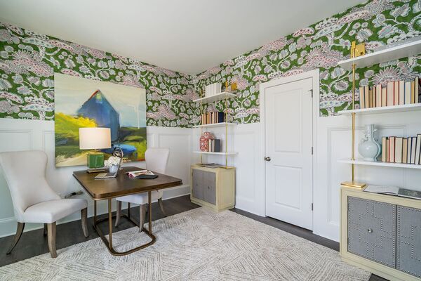 Image of a home office with green floral wall paper