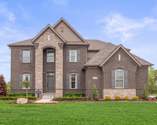 Exterior photo of a home with shrub landscaping